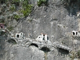 Miniature houses built into the cliff face in Praiano